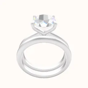 Beveled Solitaire Engagement Ring With Petal Four Prong Head and Matching Band